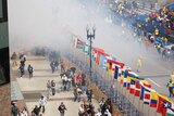 Smoke rises from the blast on the Boston marathon route.