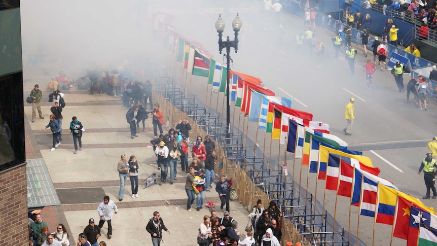 Smoke rises from the blast on the Boston marathon route.