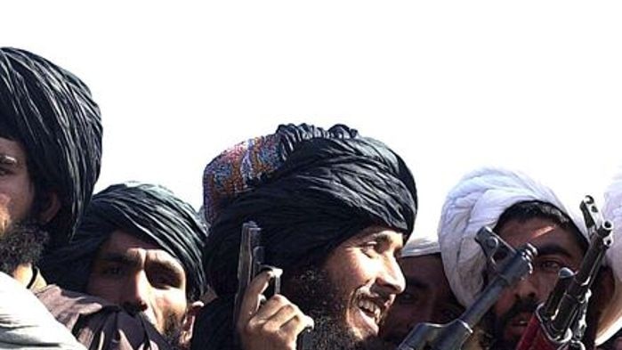 Taliban militiamen show off their weapons to foreign journalists in Kandahar, Afghanistan