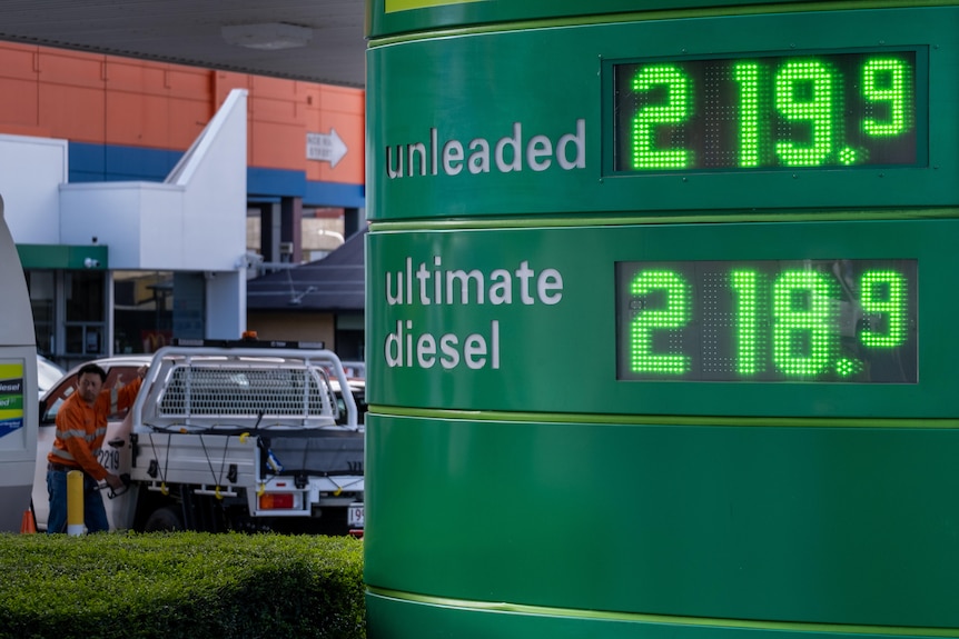 A petrol price sign reads: unleaded, two dollars and nineteen cents, diesel, two dollars and eighteen cents