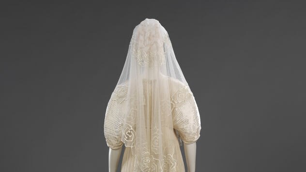 Pleated silk wedding dress and coat