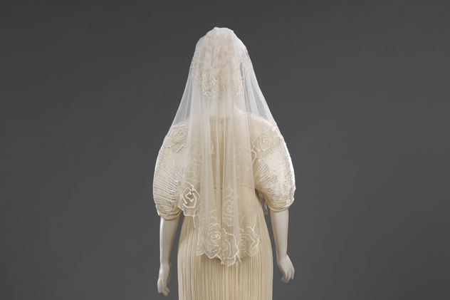 Pleated silk wedding dress and coat