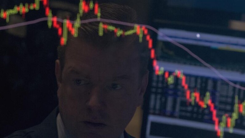 A specialist trader is reflected on his screen on the floor of the New York Stock Exchange August 25, 2015. REUTERS/Brendan McDermid