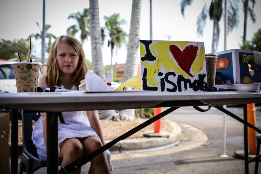 Girl with 'I love Lismore' sign