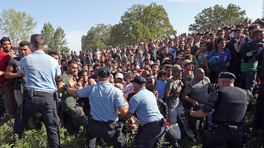 Asylum seekers break through police lines on the Croatian-Serbian border.
