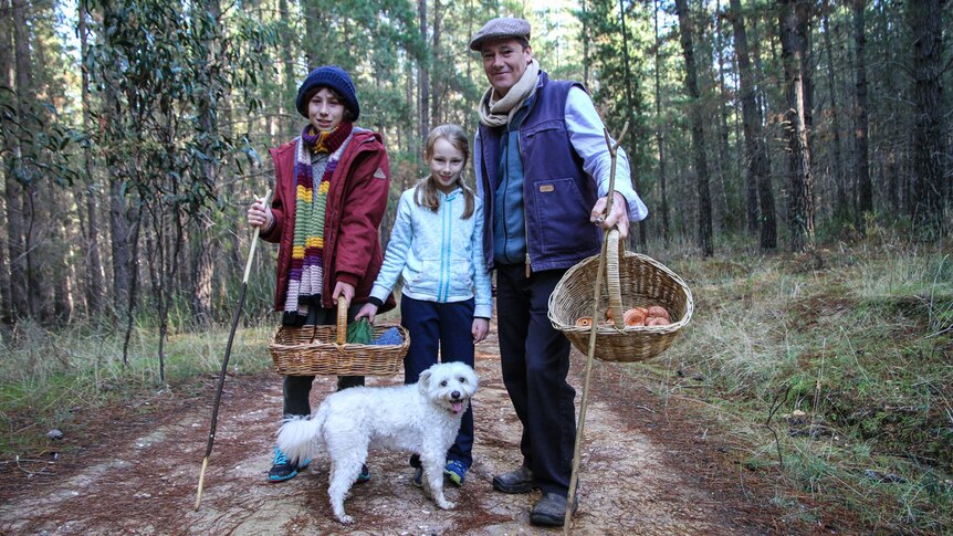 Max with his family, including the pet dog at Moonlight Flat pine plantation in Castlemaine