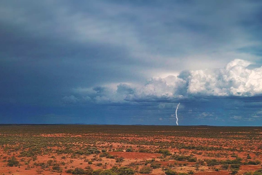 Storm over a parched land.