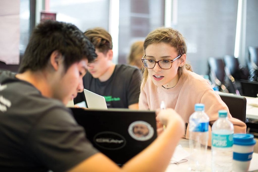 A team works on their idea at Startup Weekend Brisbane