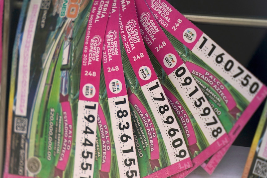 Five lottery tickets are displayed. 