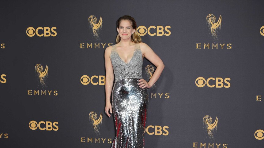 Actress Anna Chlumsky wears a sparkly silver dress.