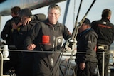 Comanche skipper Jim Cooney celebrates the win.