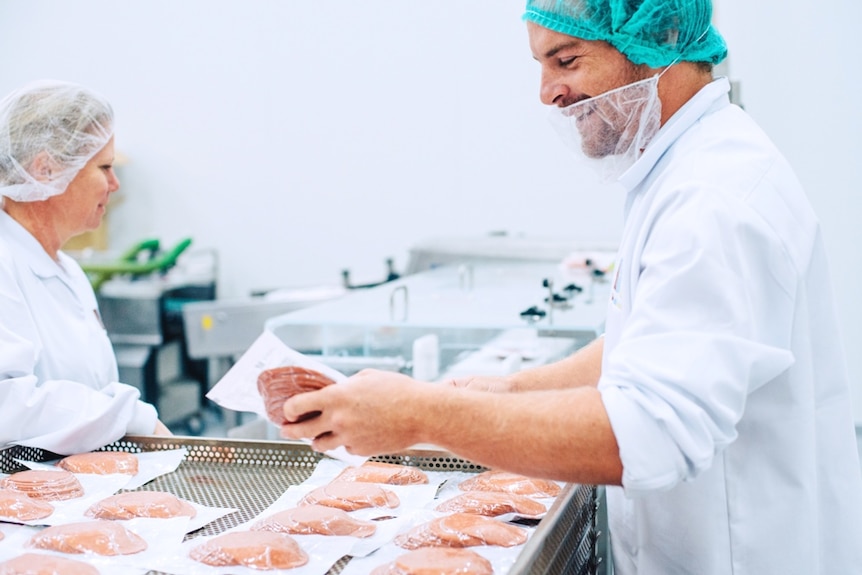 Workers in the Life Health Food plant in NSW package up meat analogue products.