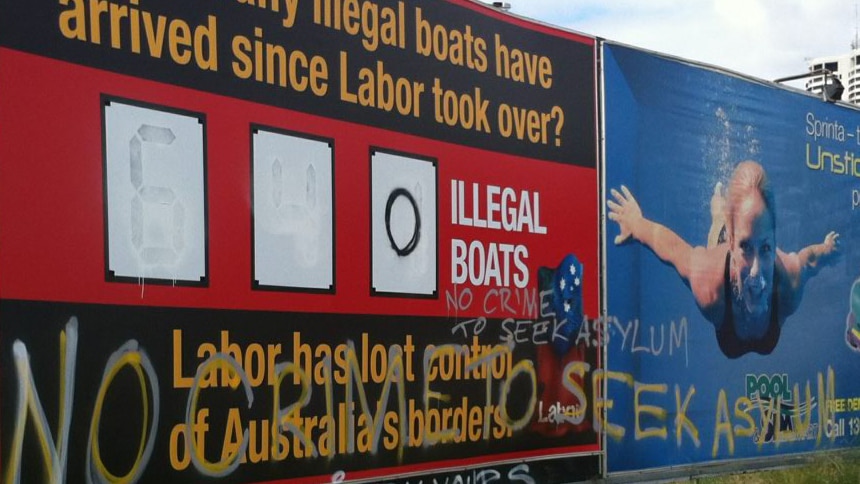 Defaced Liberal sign about 'illegal' boats