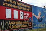 Defaced Liberal sign about 'illegal' boats