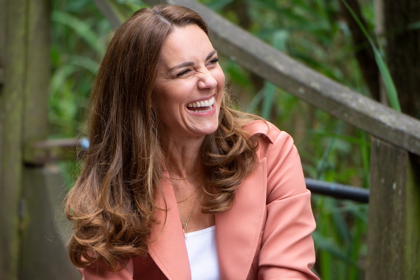 Kate Middleton laughs at something off-camera during a visit to the Natural History Museum in London, June 2021.