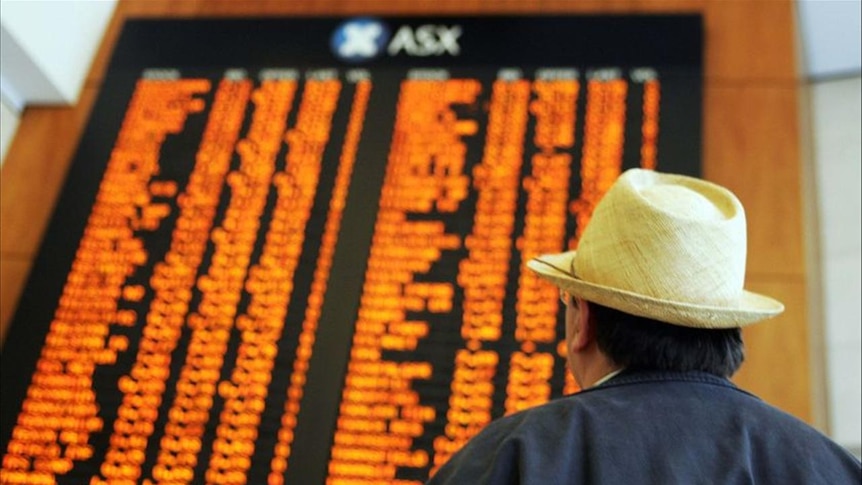 An investor watches the share prices at the Australian Securities Exchange