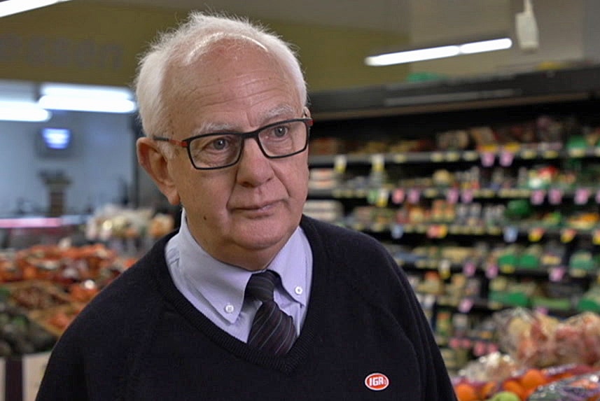 Bob Mathews stands in a grocery store.