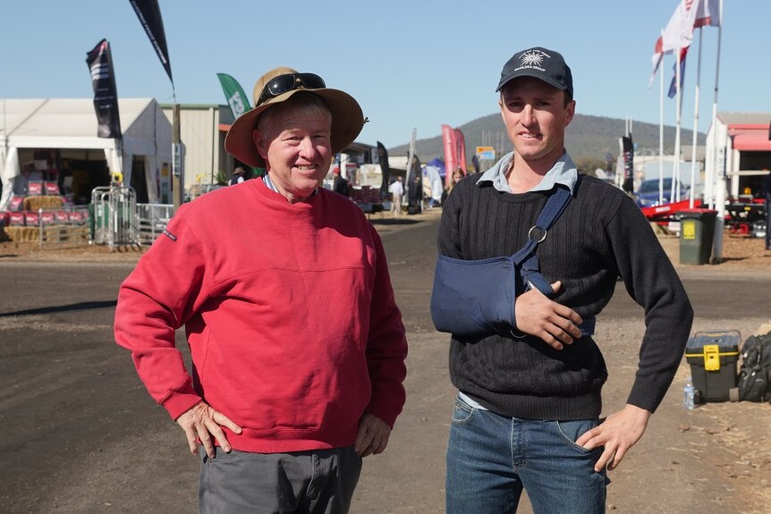 Xavier and Angus Martin stand side by side at AgQuip.