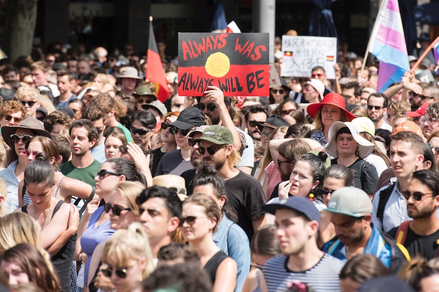 Protesters with Aboriginal flags.