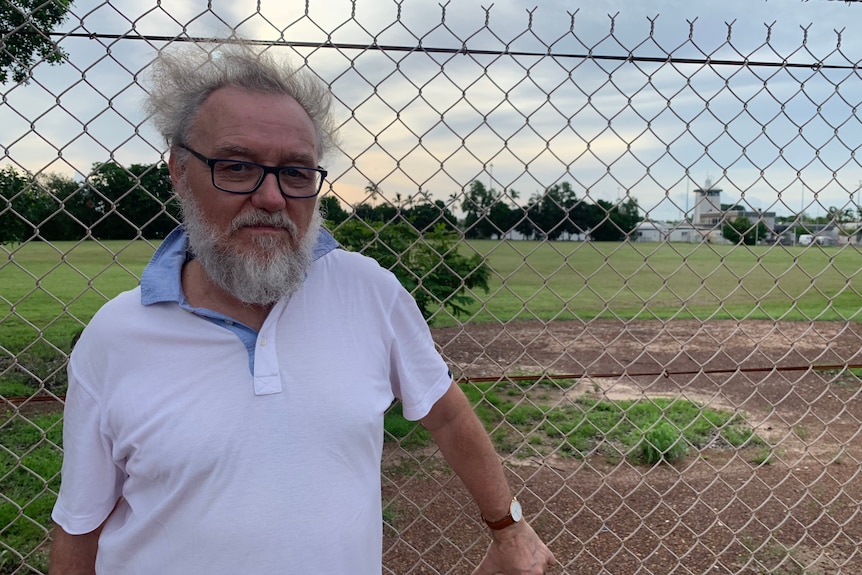 a man in his 60s or 70s poses outside a youth detention centre