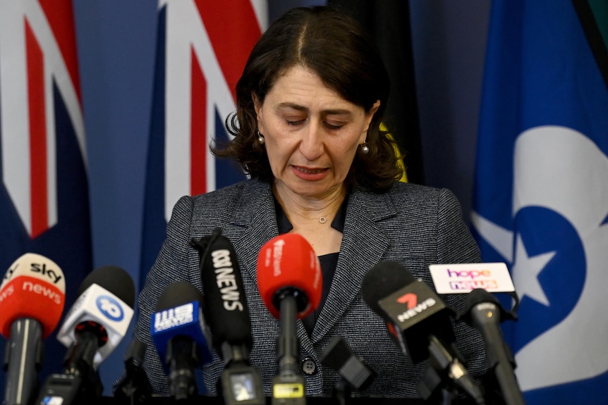 Gladys Berejiklian looks down at the ground