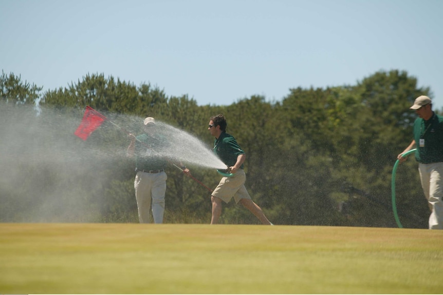 Staff water the grass at Shinnecock Hill during the 2004 US Open golf tournament