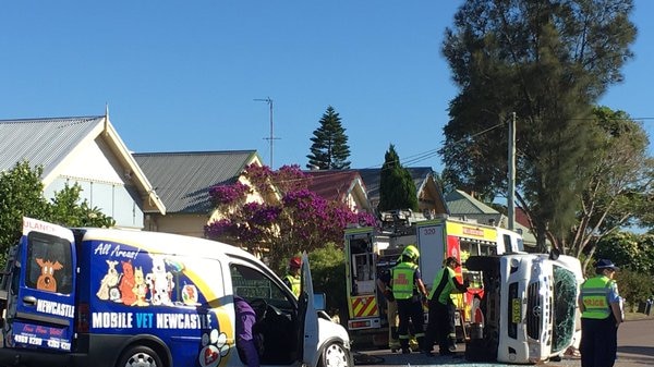 A police van has flipped in inner Newcastle after a crash.