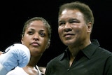 Muhammad Ali (R) with his daughter, Laila Ali, in Las Vegas in August 2002.