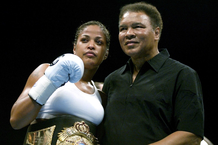 Muhammad Ali (R) with his daughter, Laila Ali, in Las Vegas in August 2002.