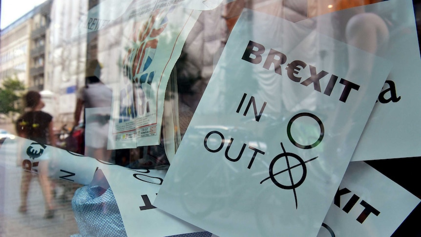 A poster featuring a Brexit vote ballot with "out" tagged is on display at a book shop window in Berlin on June 24, 2016.