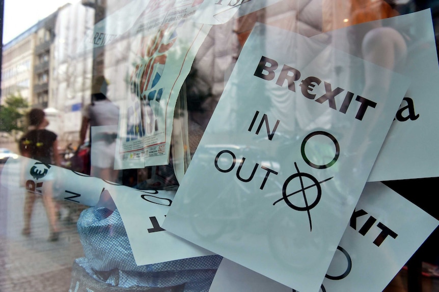 A poster featuring a Brexit vote ballot with "out" tagged is on display at a book shop window in Berlin on June 24, 2016.