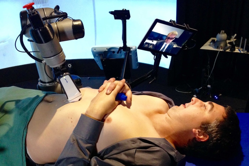 Ultrasound robot working on male patient