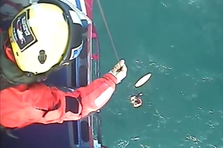 Surfer Matthew Bryce being rescued by helicopter in Irish Sea