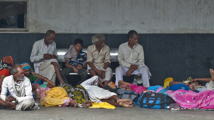 Indians sleep at train station