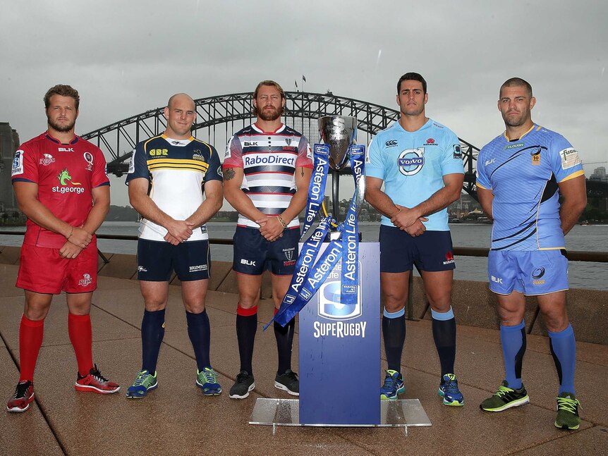 Super Rugby team captains pose with the Super Rugby trophy during the Super Rugby 2015 season launch