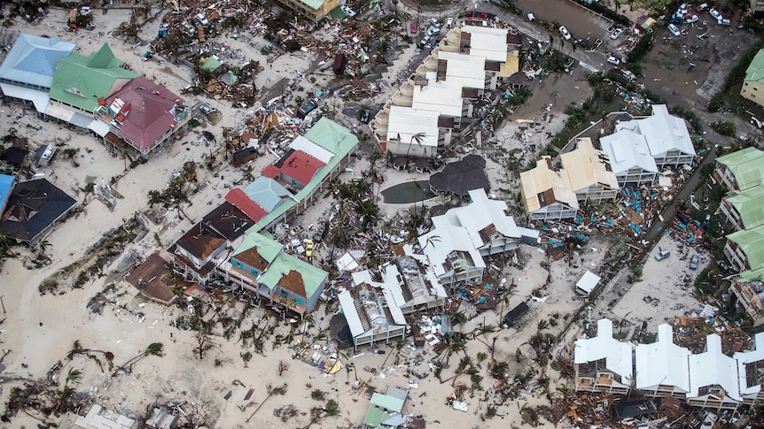 Aerial shot shows several homes levelled on saint martin by the beach