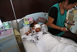 Boy lies in China hospital after attack