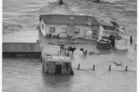 house in the middle of flood waters