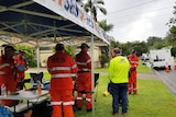 SES crews in a tent on a suburban street in Brisbane
