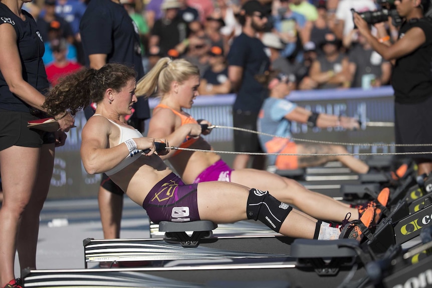 Tia-Clair Toomey and other Crossfit athletes work out during the 2015 Crossfit Games