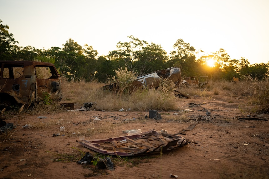 Burnt out cars in scrub near Wadeye.