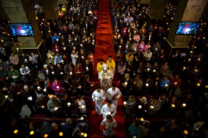 Chinese Bishop Joseph Li Shan leads mass at a government-sanctioned Catholic church in Beijing.