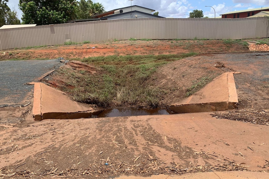 A large hole next to a road in South Hedland