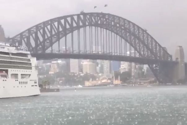 Hail falling in front of Sydney Harbour Bridge