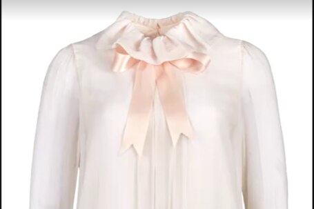 The pink blouse with a large bow 