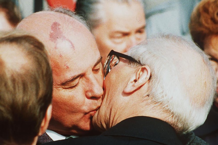 Mikhail Gorbachev kissing East Germany leader Erich Honecker.