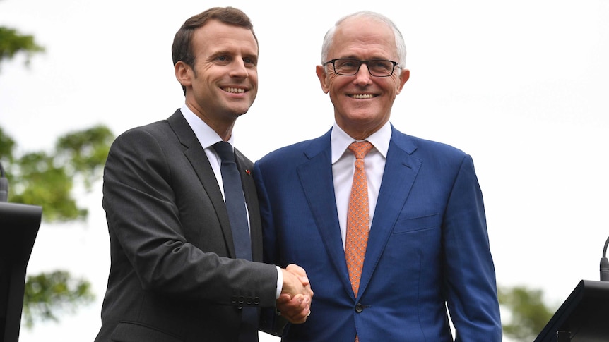 Malcolm Turnbull and Emmanuel Macron shake hands at a joint press conference in Sydney.
