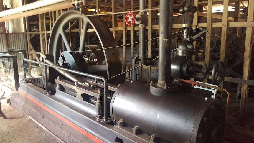 The black and red steam engine, pushes a piston, which moves a big wheel to run the woolscour machinery.