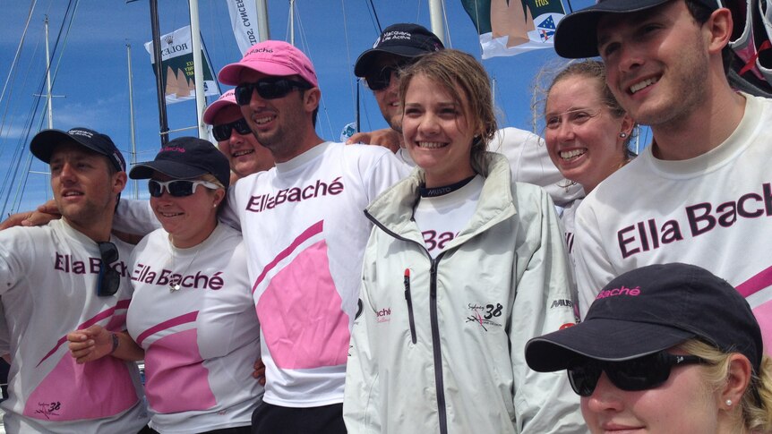 Jessica Watson is surrounded by the crew of Ella Bache