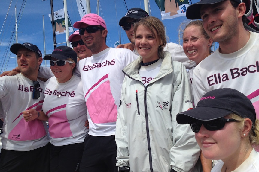 Jessica Watson is surrounded by the crew of Ella Bache